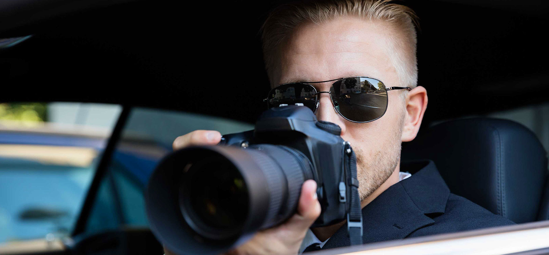 Private investigator with a camera